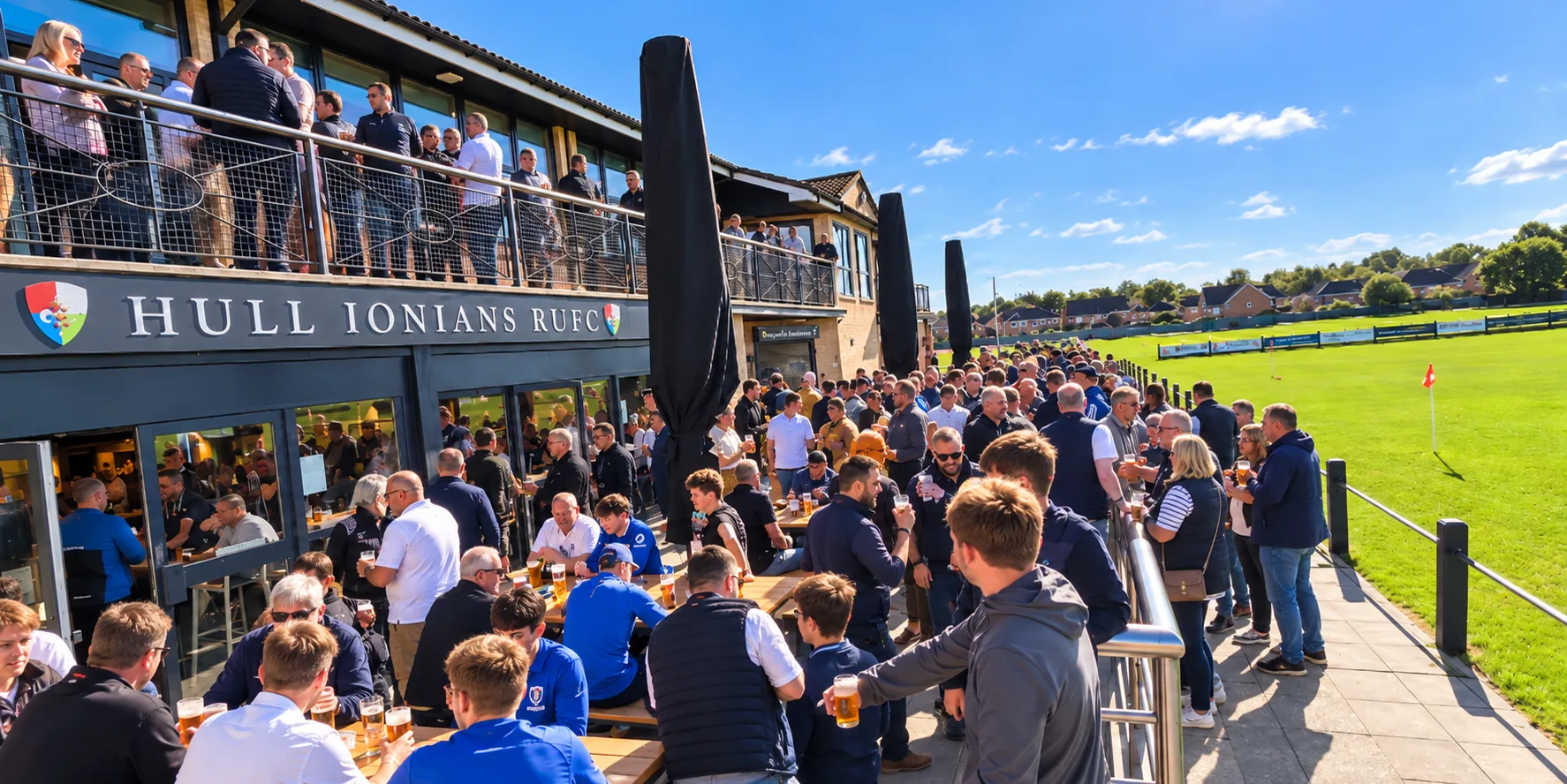 Supporters gathered on the outdoor patio at Brantingham Park Fan Zone